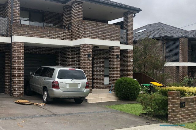 A house with a car out the front