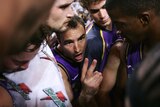 Jason Smith talks to his team in a huddle