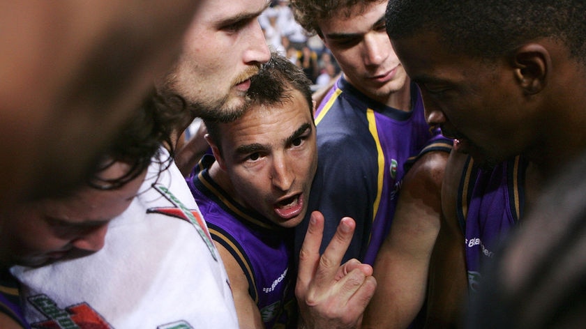 Jason Smith talks to his team in a huddle