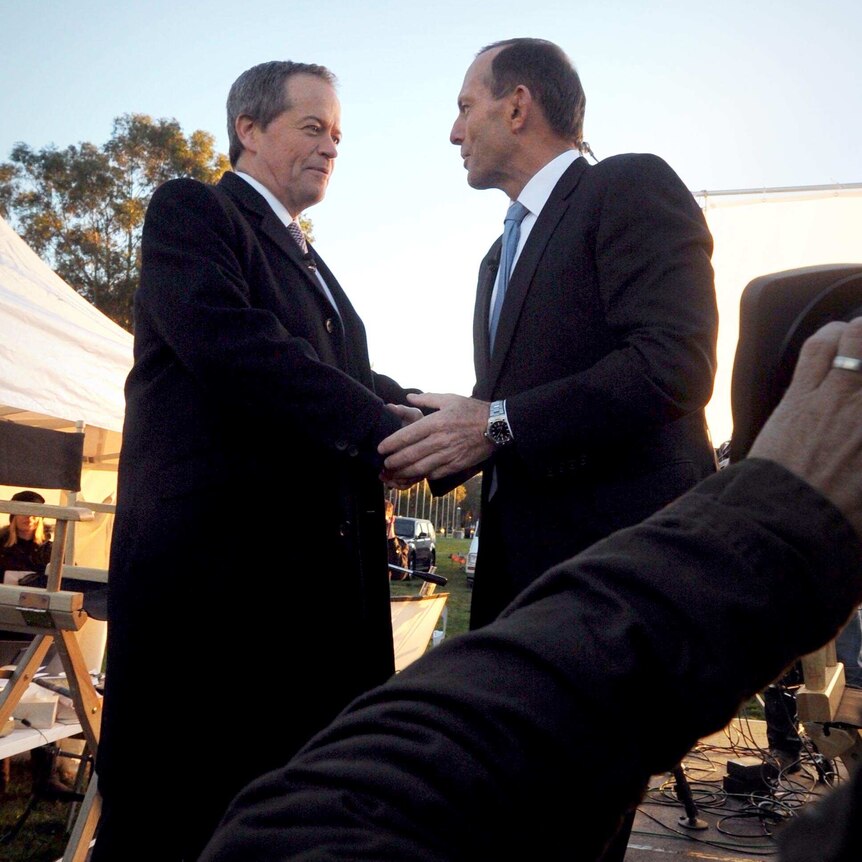 Opposition Leader Bill Shorten shakes hands with Prime Minister Tony Abbott