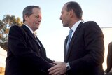 Opposition Leader Bill Shorten shakes hands with Prime Minister Tony Abbott
