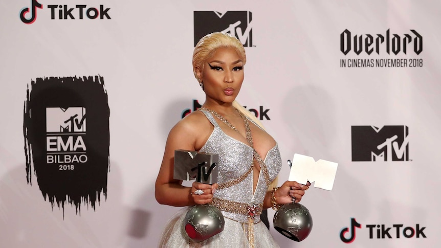 Nicki Minaj poses with her MTV trophies during the 2018 MTV Europe Music Awards.