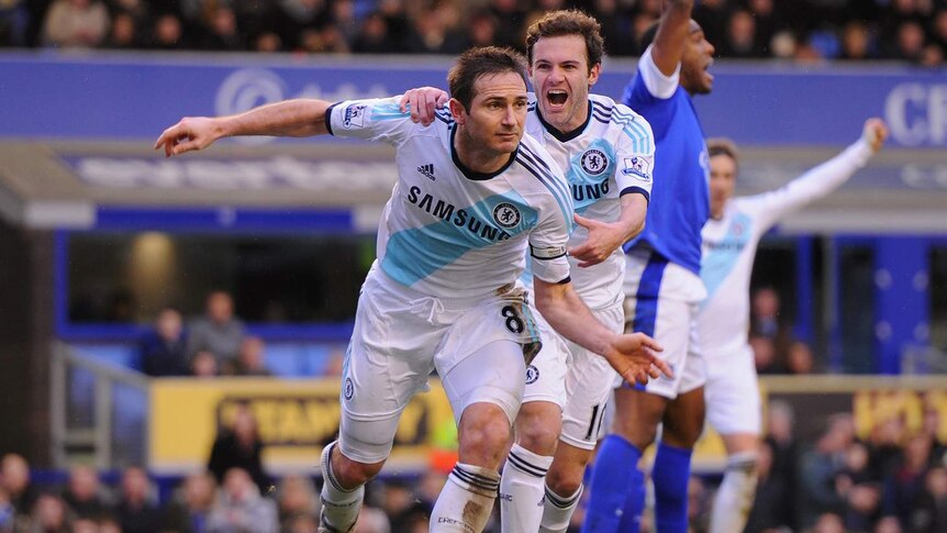 Frank Lampard (L) scores his team's second goal against Everton.