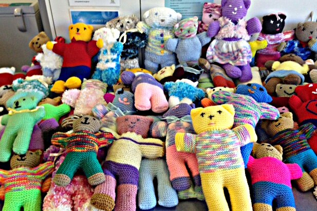 The growing pile of teddies knitted by volunteers.