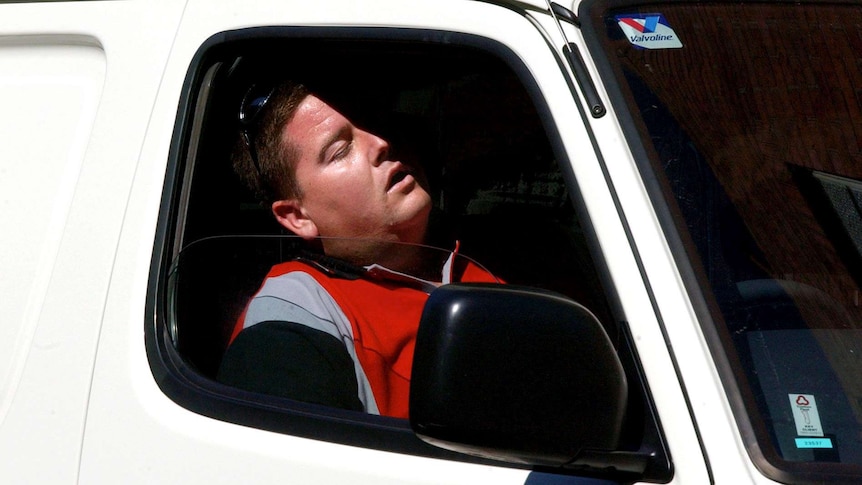 Man takes nap in van