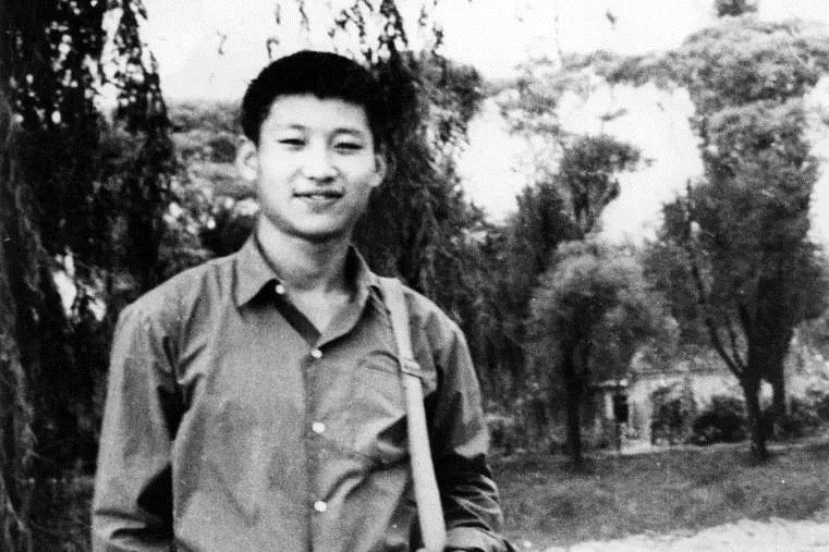 A black and white photo of Xi Jinping as a young man.