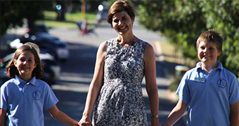 Nedlands resident Kellie Hasluck holding hands with her daughter Avalon and son Oliver.