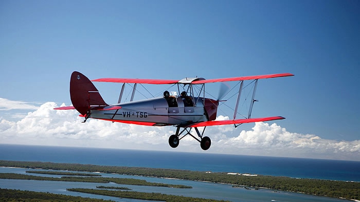 A Tiger Moth Joy Ride plane flies over Stradbroke Island near Brisbane in Queensland.
