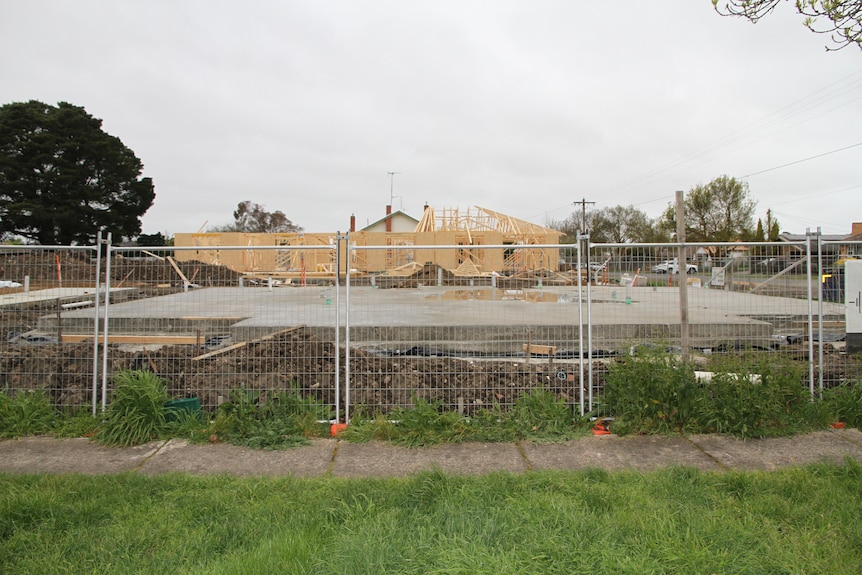 empty job site concrete slab and timber frames