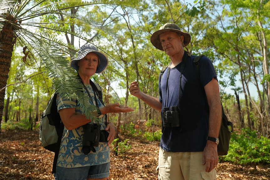 Ian Redmond and his partner Gayle stand near a cycad at Lee Point. 