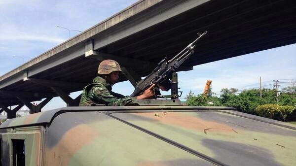 Soldier sits in a tank in Bangkok