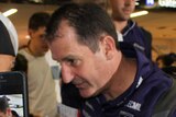 Ross Lyon is mobbed by fans at Perth Airport