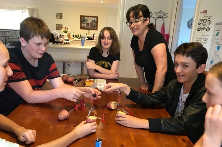 A group of people around a table.