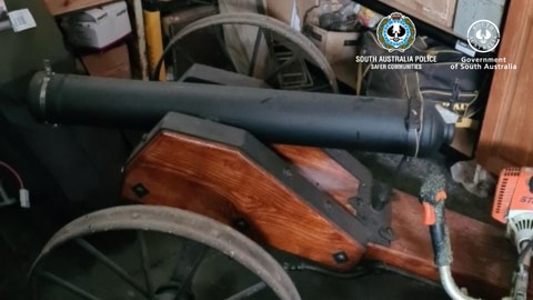 An old style cannon with wooden frame