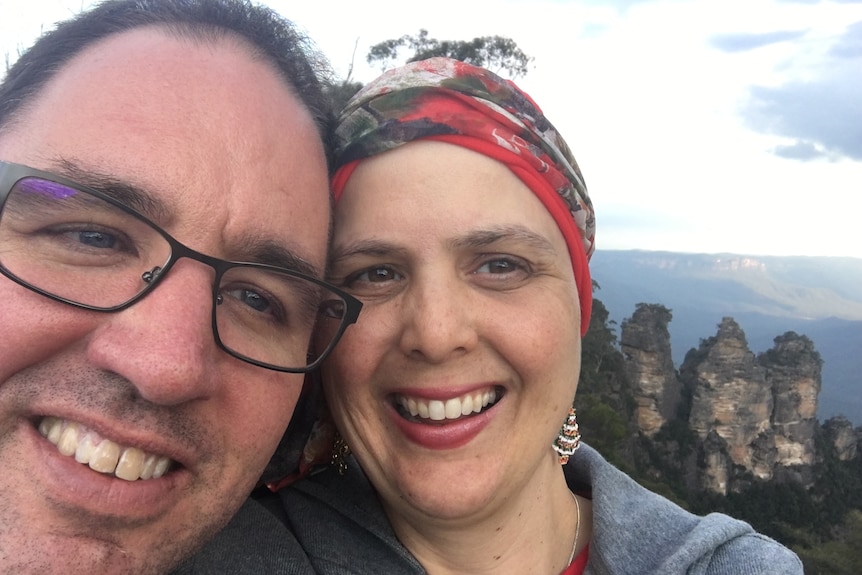 Nicola and Scott pose for a photo on a trip to the Blue Mountains while she was having chemotherapy.