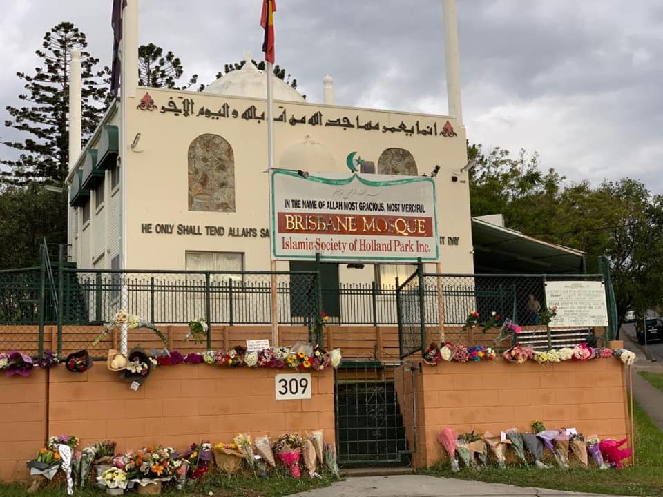 Outside the Holland Park mosque, dozens of flowers shown laid on the outside walls. 