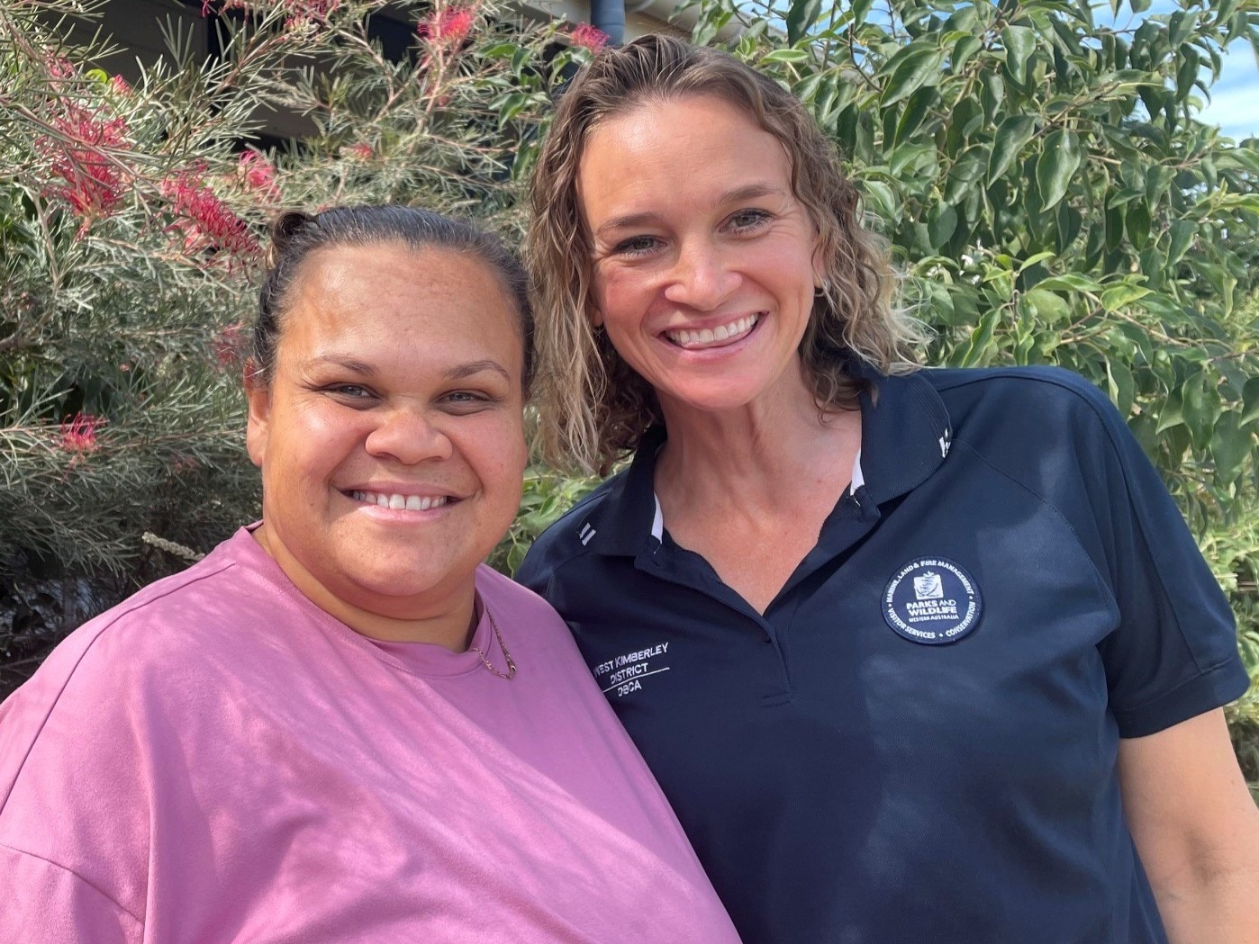 two women smiling to camera