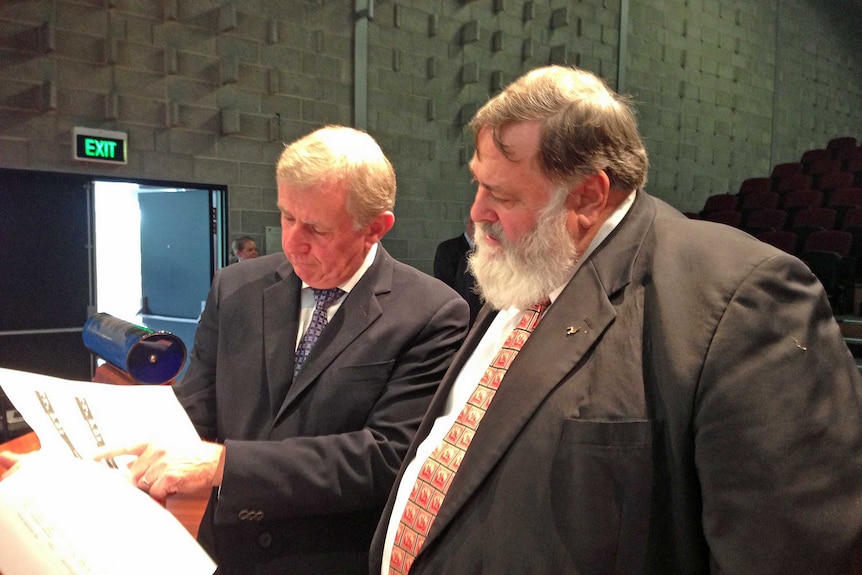 Federal Regional Development Minister Simon Crean and Lyons MHR Dick Adams read the forestry jobs impact report.