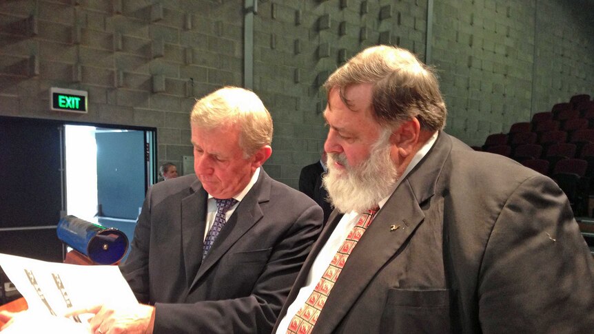 Federal Regional Development Minister Simon Crean and Lyons MHR Dick Adams read the forestry jobs impact report.