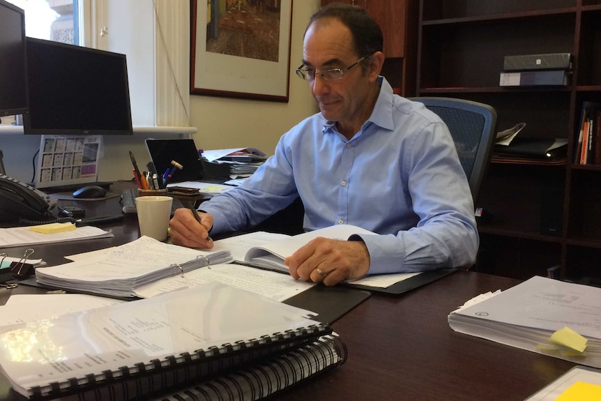 Chief Justice Chris Kourakis at his desk.