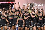Rugby league grand final winner celebrate with the trophy