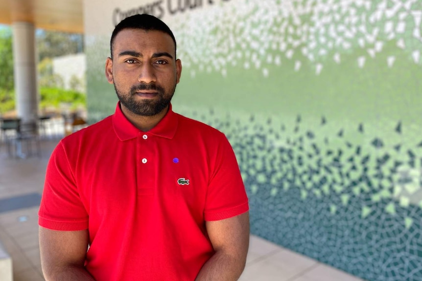 A man in a red polo shirt