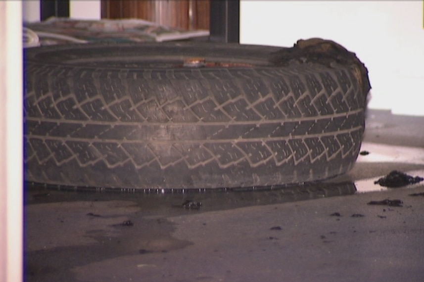 Burnt tyre inside office after an early-morning fire at the office of Brisbane Councillor Ryan Murphy