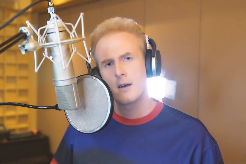 a man singing in a studio