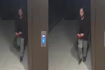 A man walking down the street on CCTV.