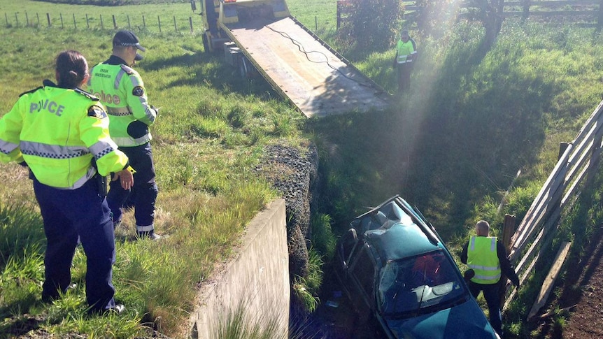 A woman died when her car careered off the Bass Highway near Penguin.