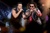 Singers Luis Fonsi and Daddy Yankee perform and dance on stage during Latin Billboard Awards.