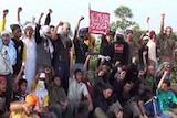 Members of a new terrorist cell in Aceh, north Sumatra, raise their fists