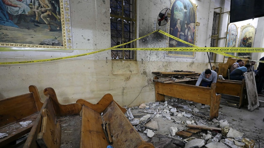 Seating is destroyed and debris is strewn through the coptic church