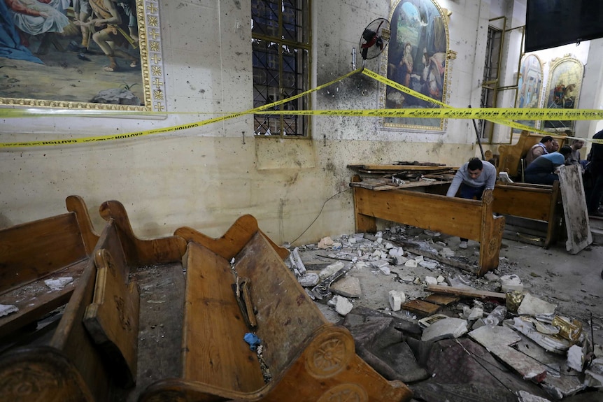 Seating is destroyed and debris is strewn through the coptic church