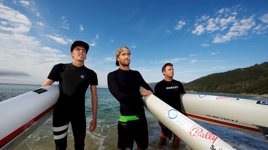 Australian paddle boarders Zeb Walsh, Brad Gaul, and Californian Jack Bark.