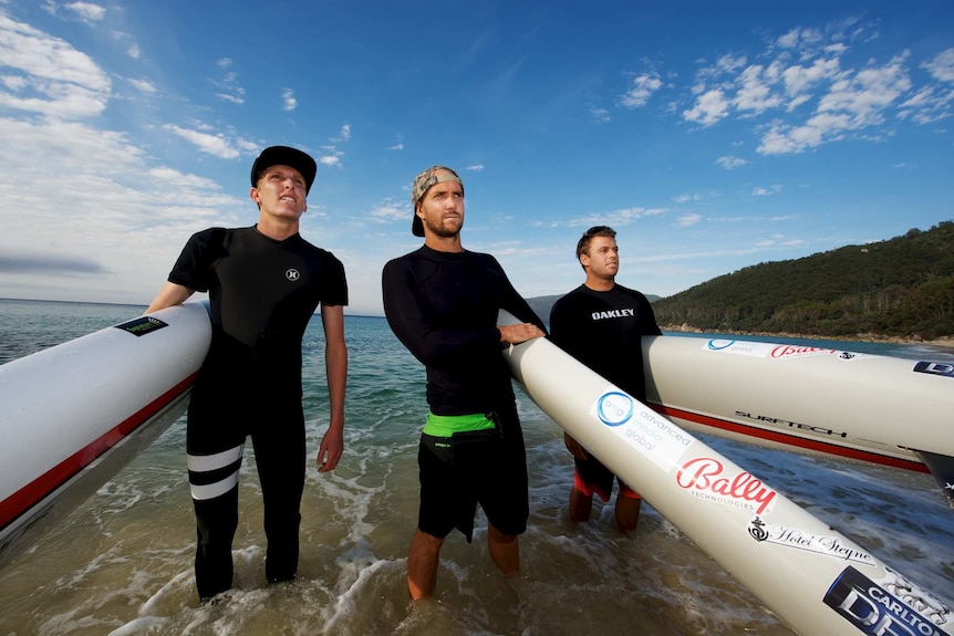 Australian paddle boarders Zeb Walsh, Brad Gaul, and Californian Jack Bark.