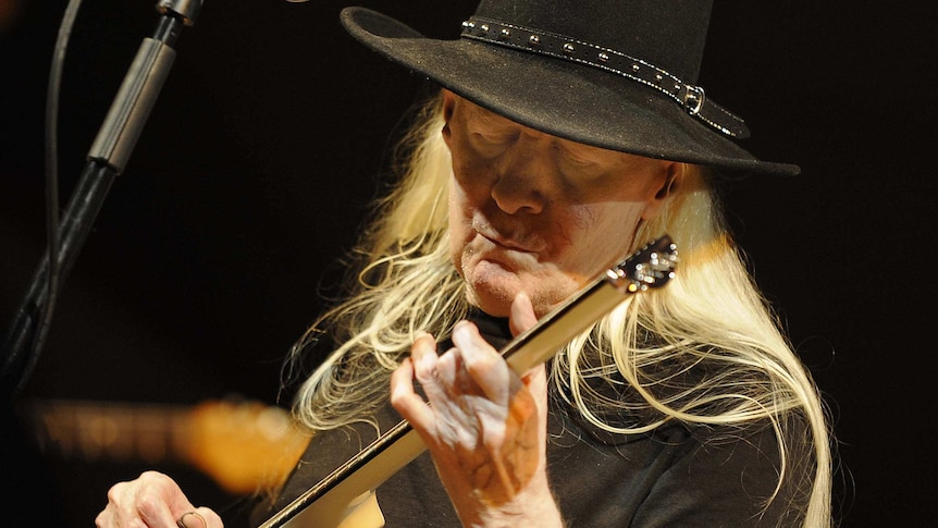 US guitarist Johnny Winter performing on stage