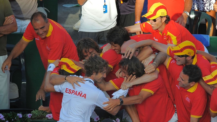 Juan Carlos Ferrero celebrates with team-mates