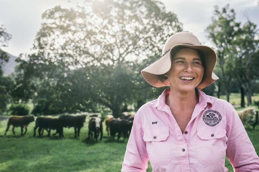 woman standing in paddock 