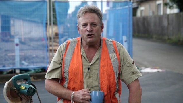 A man dressed as a tradesman in high vis for a Liberal Party campaign advertisement