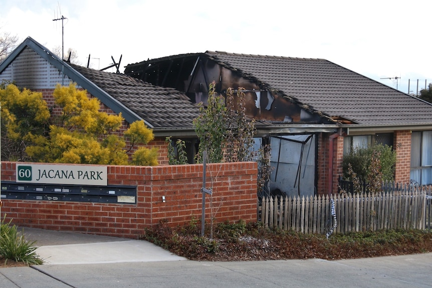 A residential dwelling with significant fire damage.