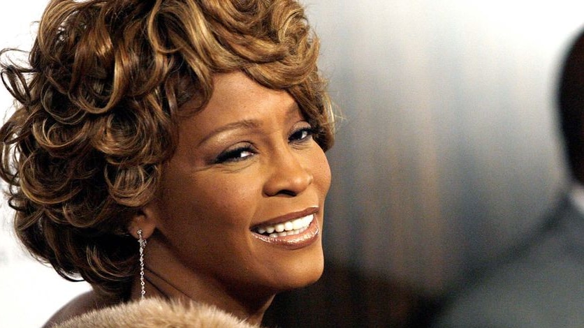 Whitney Houston arriving at an awards ceremony