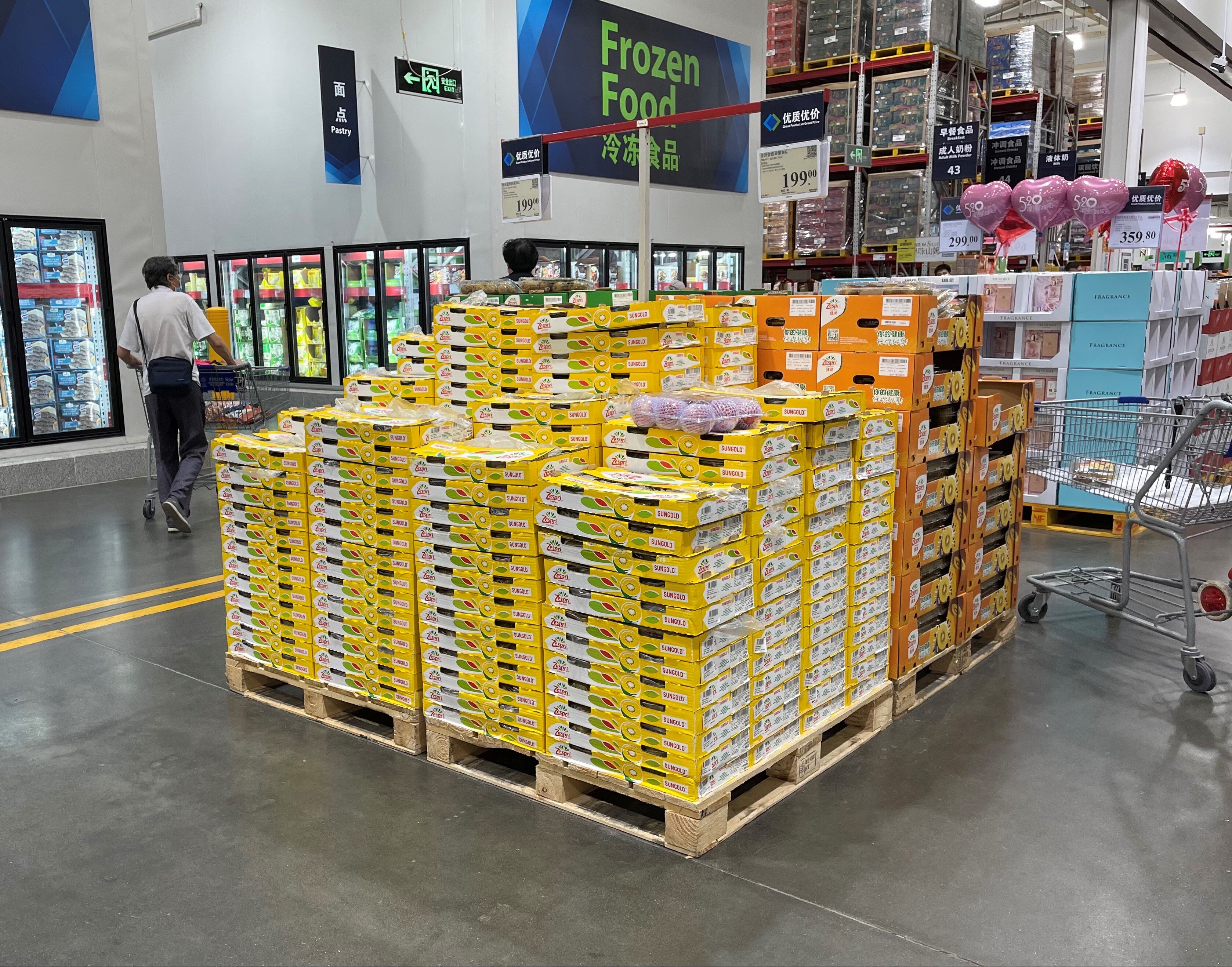 A stack of SunGold cartons on a supermarket floor. 