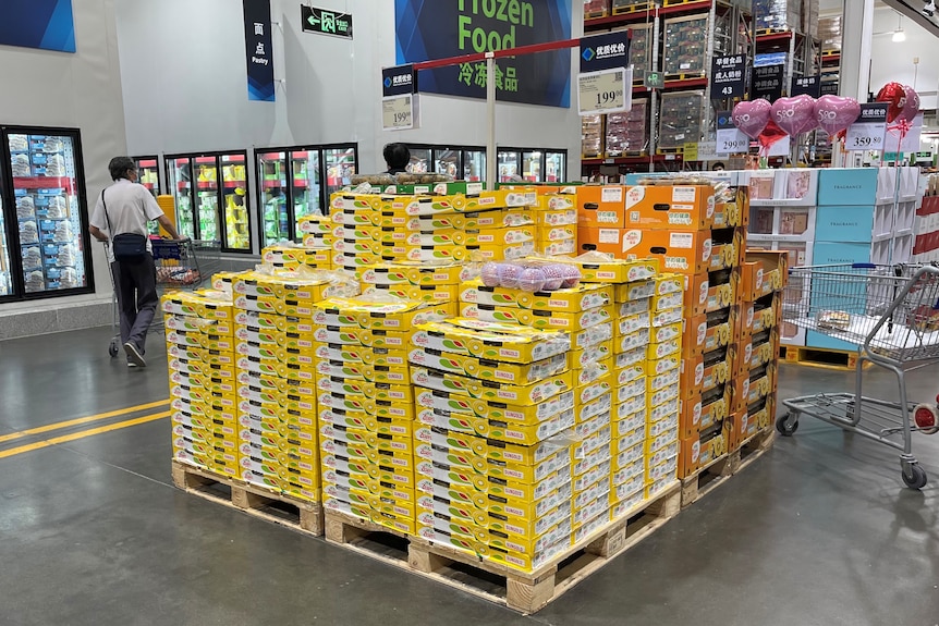 A stack of SunGold cartons on a supermarket floor. 