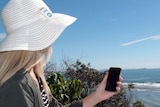 The smartphone is held in the sun to detect how much sun exposure is recieved.