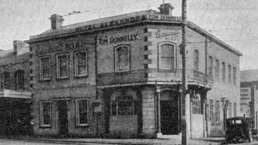 Black and white photo of old sandstone hotel in Hobart