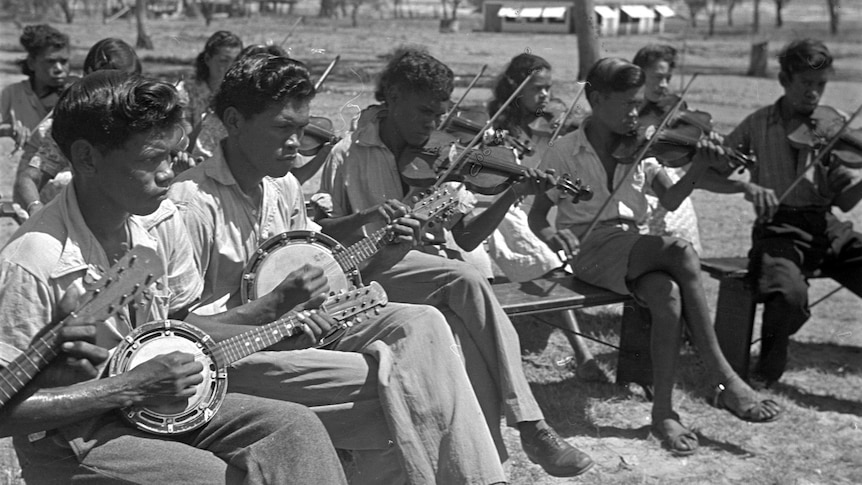 Members of the orchestra at the Derby Leprosarium playing banjos and violins.