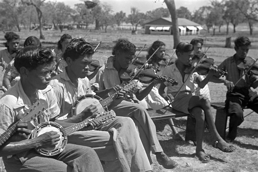 Members of the orchestra at the Derby Leprosarium playing banjos and violins.