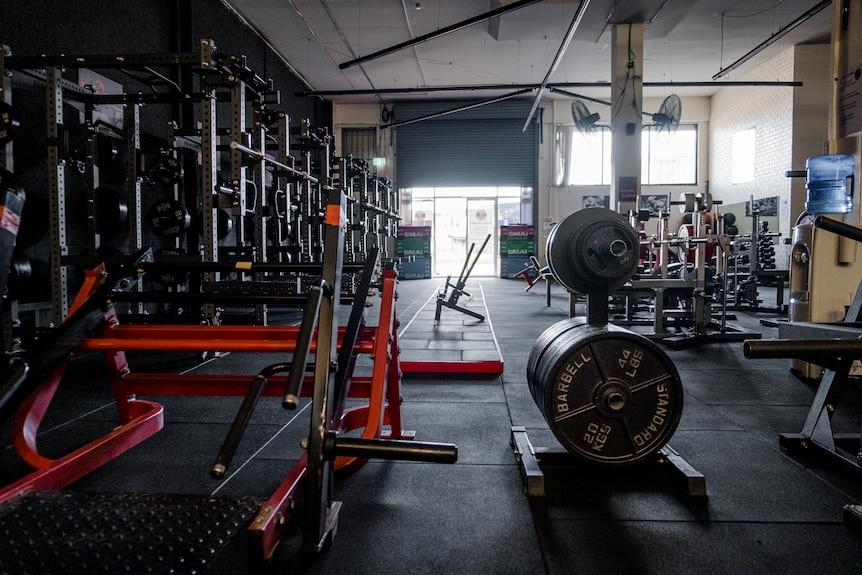 an empty gym with exercise equipment