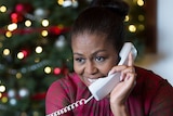 Michelle Obama takes calls for the NORAD Tracking Santa program.